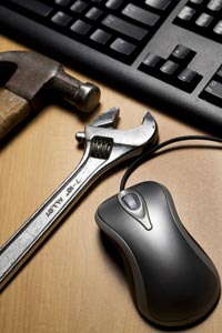 Picture of a hammer, wrench, mouse and keyboard
